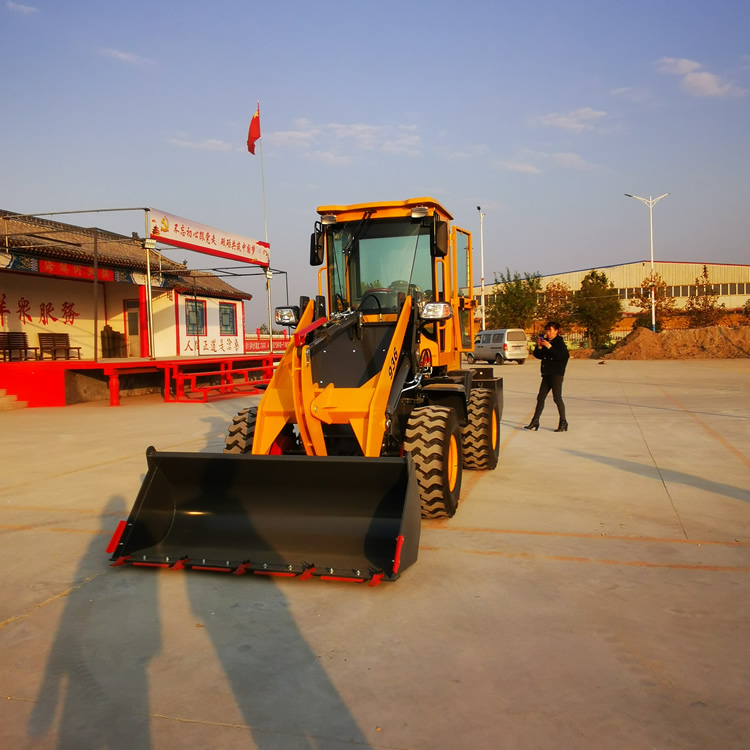 荣威936装载机中方九迪喷水车