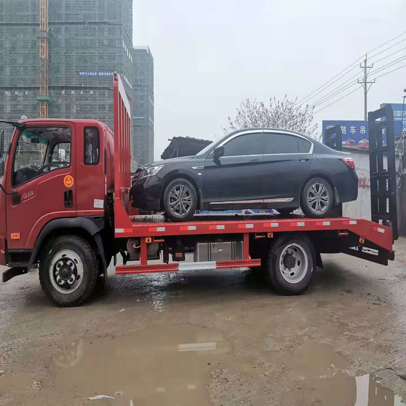 黄牌拖车大运170马力可承重15吨挖机平板拖车价格